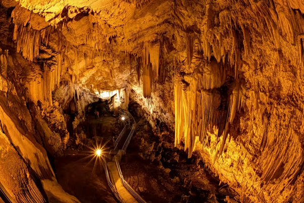 Cave of Antiparos with illuminated stalactites and underground formations