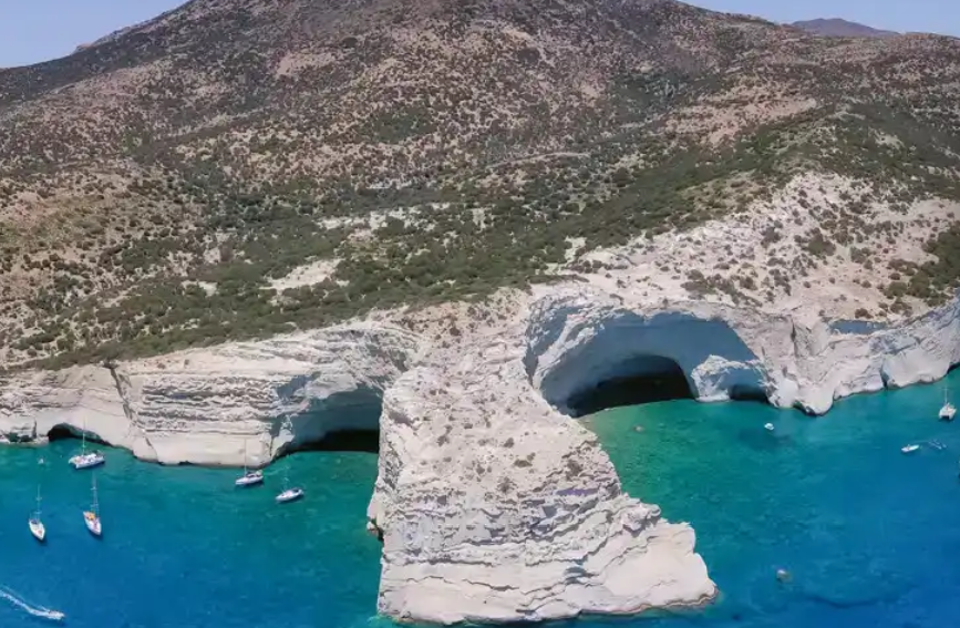 Dramatic white cliff formations and crystal clear waters at Kleftiko Milos