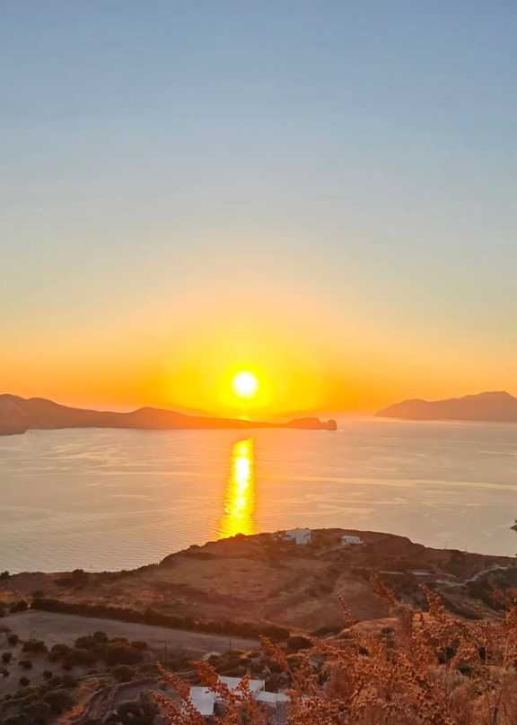 Golden sunset view over the Aegean Sea coastline from Plaka Milos