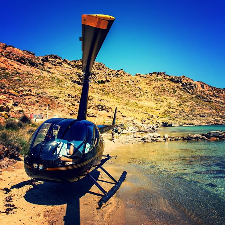 Private helicopter landing by the sea in Paros Greece
