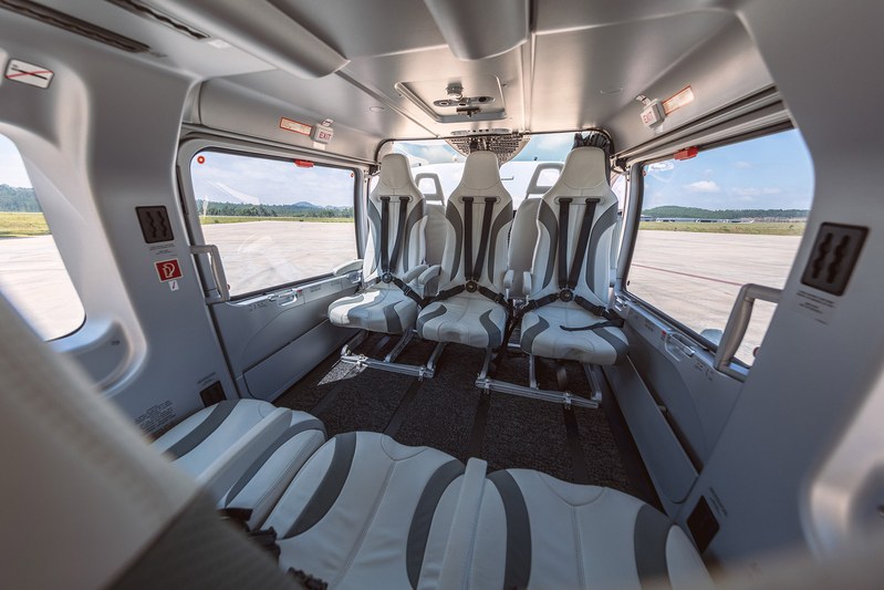 Private helicopter cabin interior with leather seats for luxury transfers in Greece